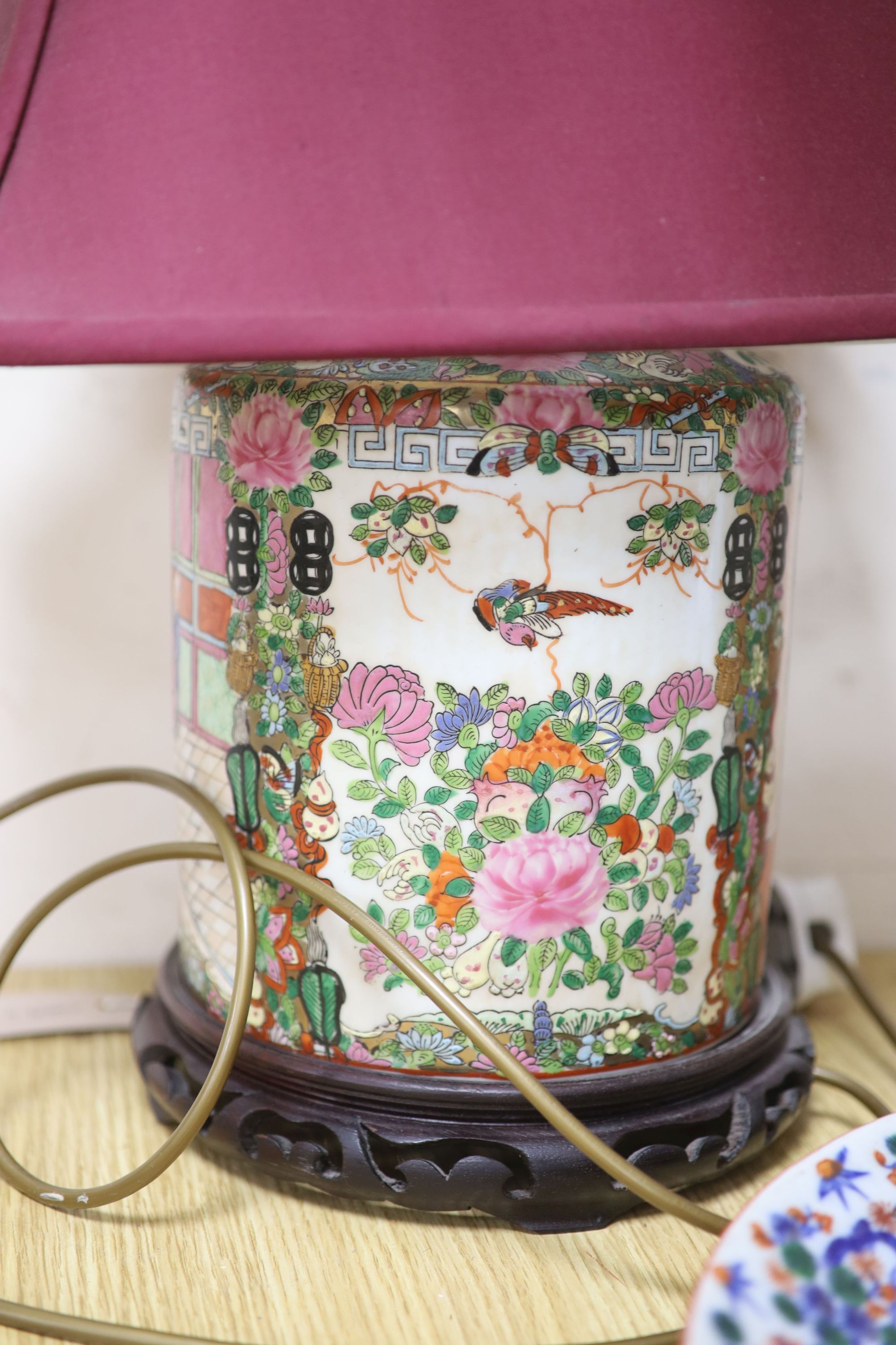 A pair of Chinese famille rose table lamps, 35cm high to lamp fitting, a blue and white jar and cover, a dish and a horse print